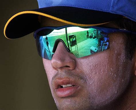 Rahul Dravid watches the proceedings from the dressing room ...