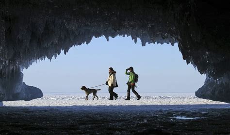 Sightseers Exploring Ice Caves