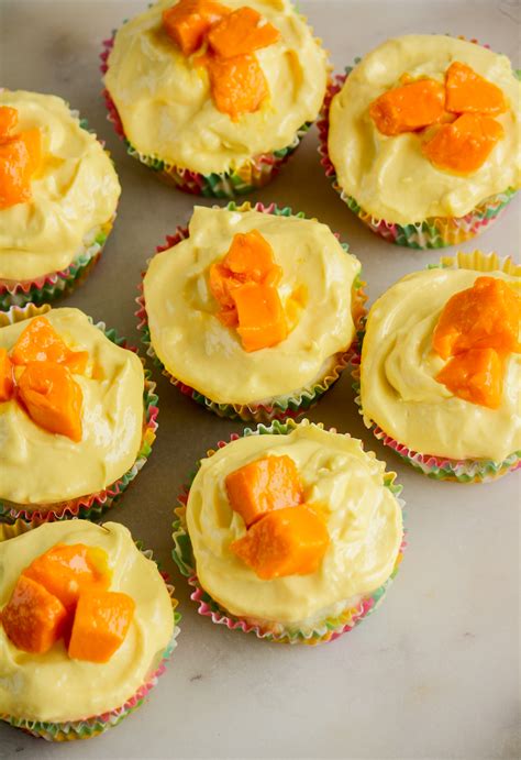 Coconut Cupcakes With Mango Frosting The Desserted Girl