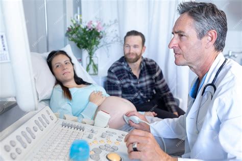 Premium Photo Doctor Doing Ultrasound Scan For Pregnant Woman In Hospital