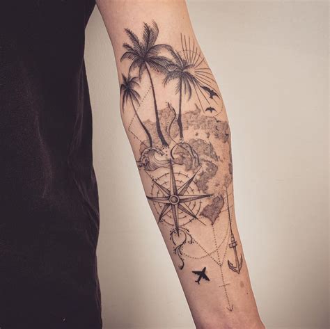 A Mans Arm With A Compass And Palm Trees On The Beach Tattoo Design