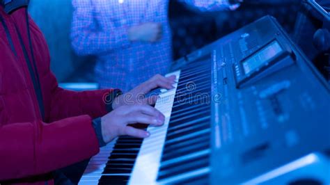 Close Up Shot Of Male Hands Playing On Electronic Piano Stock Image