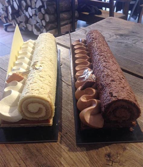 Two Trays With Different Types Of Food On Them Sitting On A Wooden