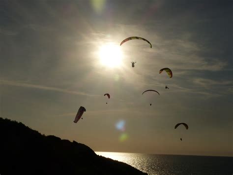 Paragliding sparnas saulė dangus vandenynas nemokamos nuotraukos