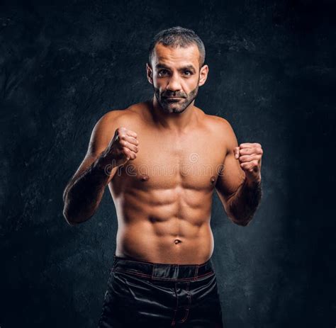 Portrait Of A Brutal Professional Fighter With Naked Torso Posing For A Camera Stock Photo