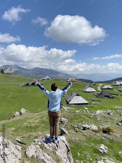 Woman Enjoys Views Of The Alpine Village In The Mountains Velika