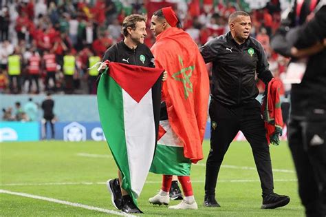 Morocco players celebrate with Palestinian flag after Spain upset ...