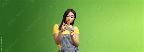 Carefree Geeky Cute Asian Brunette Waste Time University Campus Playing Online Smartphone Game