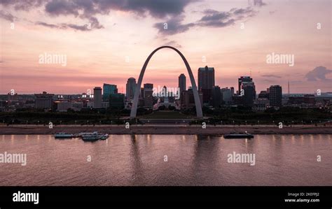 An aerial scenic shot of the Gateway Arch from across the river ...