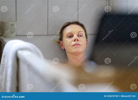 Woman Relaxing In A Hot Bath Reading On A Tablet Stock Photo Image Of Water Relax 255078700