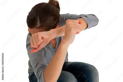 Teenage Girl Protect Herself With Arms Crossed In Front Of Face