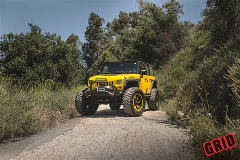 Bossy Yellow Lifted Jeep Wrangler Shod in Grid Off-Road Wheels — CARiD ...