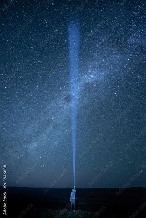 Flashlight lighting in the dark sky crossing southern Milky Way, star ...