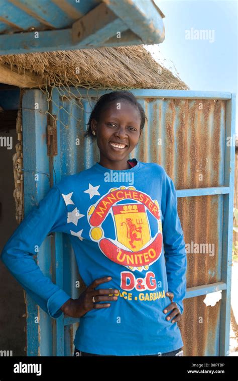 Senegalese teenage girl wearing Manchester United football shirt Stock Photo - Alamy