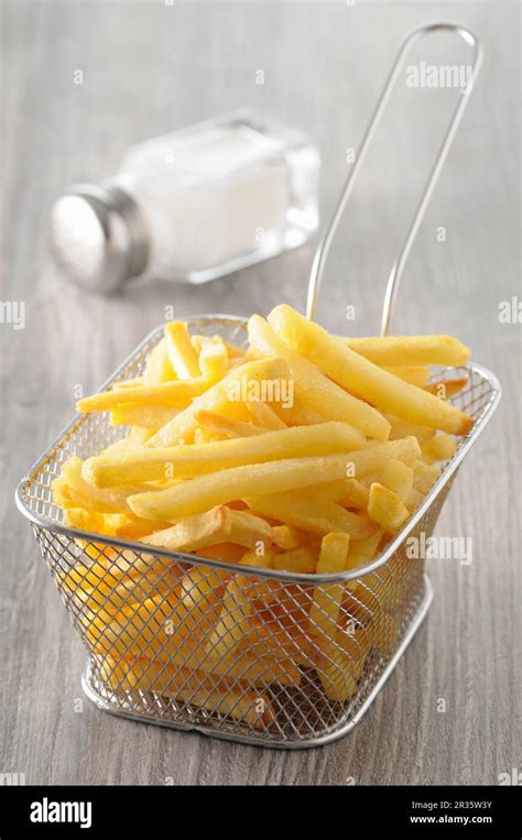 Chips in deep-frying basket Stock Photo - Alamy