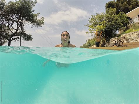 Brunette Swimming In Pool By Stocksy Contributor Guille Faingold Stocksy