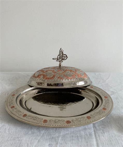 A Silver Platter With An Ornate Design On It