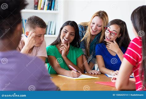 Group of Laughing International Students in Discussion Stock Photo ...