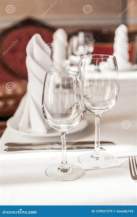 Two Empty Wine Glasses On A Served Table White Tablecloth Glasses Appliances Red Furniture