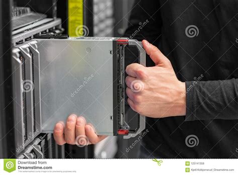 Close Up Of It Consultant Install Blade Server In Datacenter Stock