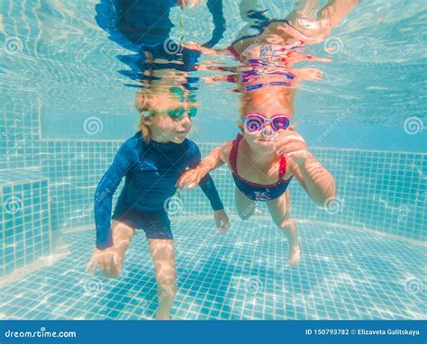 Kids Having Fun Playing Underwater in Swimming Pool on Summer Vacation ...