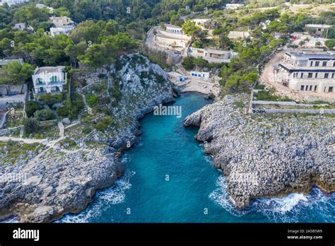 Aerial View Of The Idyllic Beach And Bay Cala Dell Acquaviva At Castro