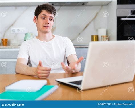 Young Guy Studying at Home with Laptop Stock Image - Image of focused, casual: 286517749