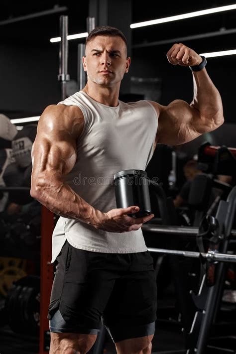 Rear View Muscular Man Showing Back Muscles At The Gym Strong Male Naked Torso Workout Stock