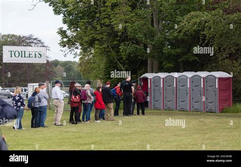 People standing in line to use the toilet at Gordon Castle Highland games near Fochabers in ...