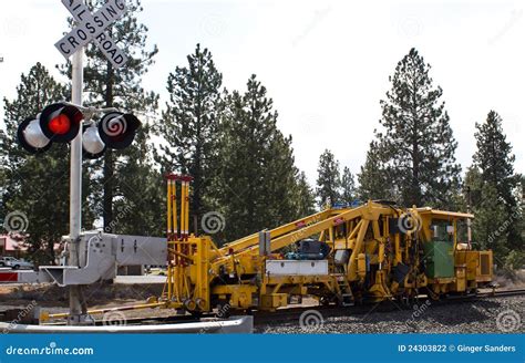 Railroad Repair Equipment at Crossing Stock Photo - Image of yellow ...