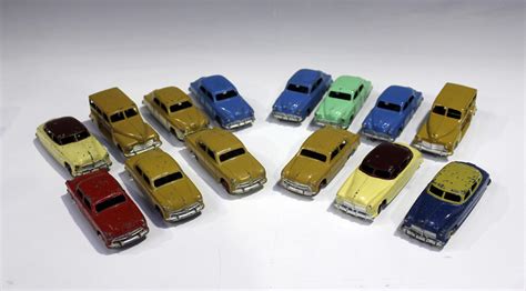 Fourteen Dinky Toys cars, comprising two No. 37f estate cars, five No ...