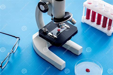 Blood Testing Laboratory Samples Viewing Under Microscope Near Tubes