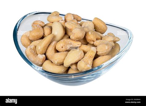 Roasted Salted Cashew Nuts In Glass Bowl Isolated On White Background