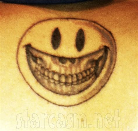 PHOTO Chris Brown's smiley face skull tattoo tweeted by girlfriend Karrueche Tran