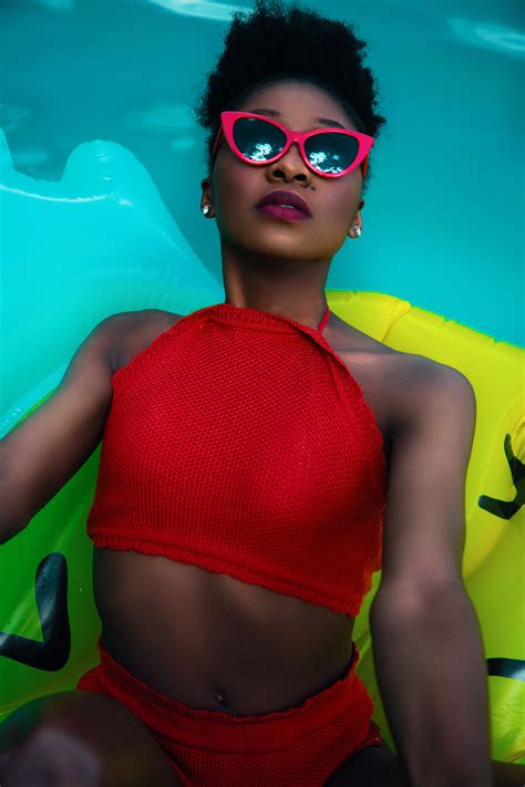 Free Photo Woman Wearing Red Bikini On Float Talking Photo On Pool