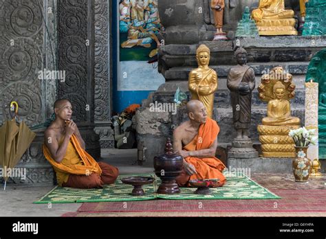 Two Monks At Small Shrine With 7 Headed Naga Mucalina Near Prasat