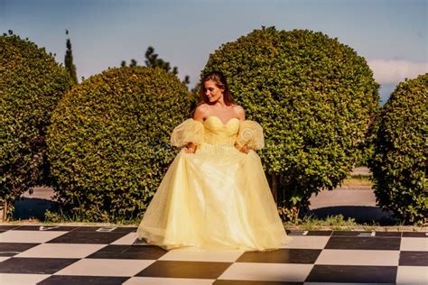 Woman Yellow Dress Chess A Beautiful Woman In A Long Puffy Yellow