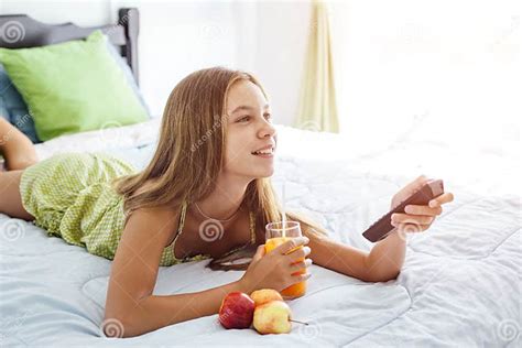 Girl Drinking Juice And Watching Tv In Bedroom Stock Image Image Of