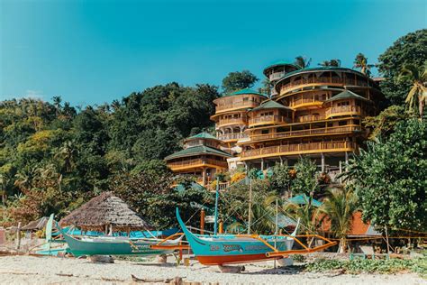 tropical resort buildings  boats   beach  stock photo