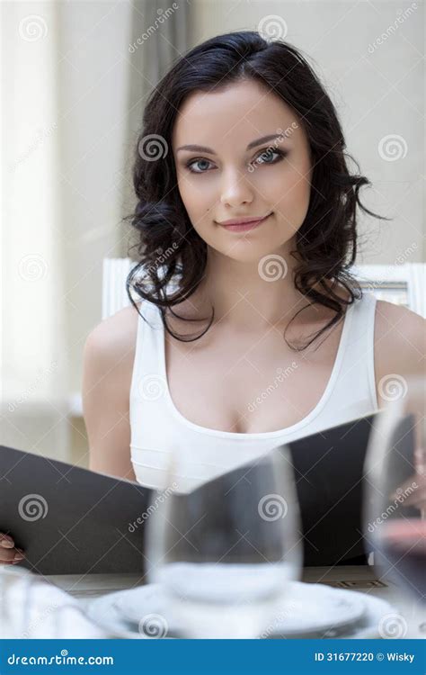 Portrait Of Cute Slim Brunette Posing With Menu Stock Photo Image 31677220
