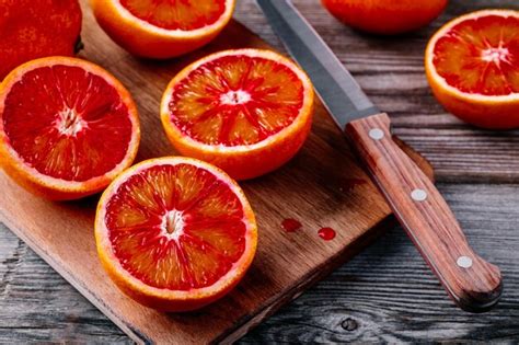 Premium Photo Sliced And Whole Ripe Juicy Sicilian Blood Oranges On