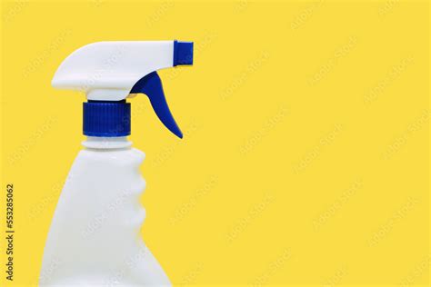 Plastic White Spray Bottle On A Yellow Background Detergent For