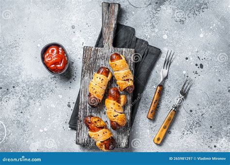 Sausage Rolls Pigs In Blanket Puff Pastry On Wooden Board Gray