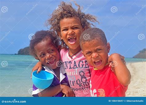 Three Little Fijian Kids From Yasawa Islands Smiling With Much