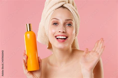 Close Up Blonde Half Naked Woman 20s Perfect Skin Nude Make Up Blue Eyes Hold Bottle Of Shampoo