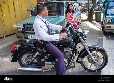 Filipino policeman on a motorcycle in downtown Manila, Philippines Stock Photo - Alamy