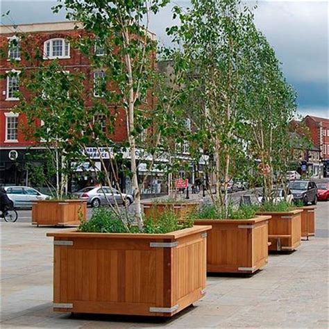 large tree pots outdoor street wood slat flower planter