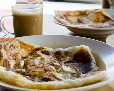 Roti Canai na Malásia é influência indiana pura um pão achatado