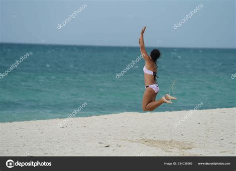 Rear View Woman Bikini Jumping Beach Stock Photo By