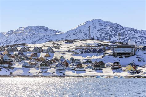 Rows of Colorful Inuit Houses Along the Fjord with Snow Mountain Stock ...